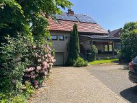 Wohnimmobilie Kauf Einfamilienhaus Willkommen im Nest der Familie: Verklinkertes Haus mit Gartenzauber, Wintergarten, Harmonie