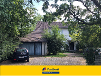 Wohnimmobilie Kauf Einfamilienhaus Voll vermietetes Architektenhaus mit Bauland im Nordwesten von Frankfurt.