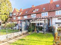 Wohnimmobilie Kauf Reihenhaus Familienfreundliches Reihenmittelhaus mit Wintergarten und pflegeleichtem Grün